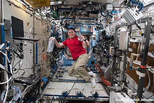 Dr. Serena Aunon Chancellor works with science gear on ISS